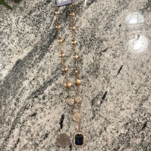 Gold necklace with blue gem